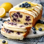 Lemon blueberry cake with cream cheese frosting and fresh blueberries
