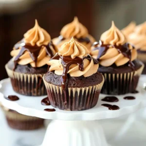 chocolate cupcakes peanut butter frosting on cake stand