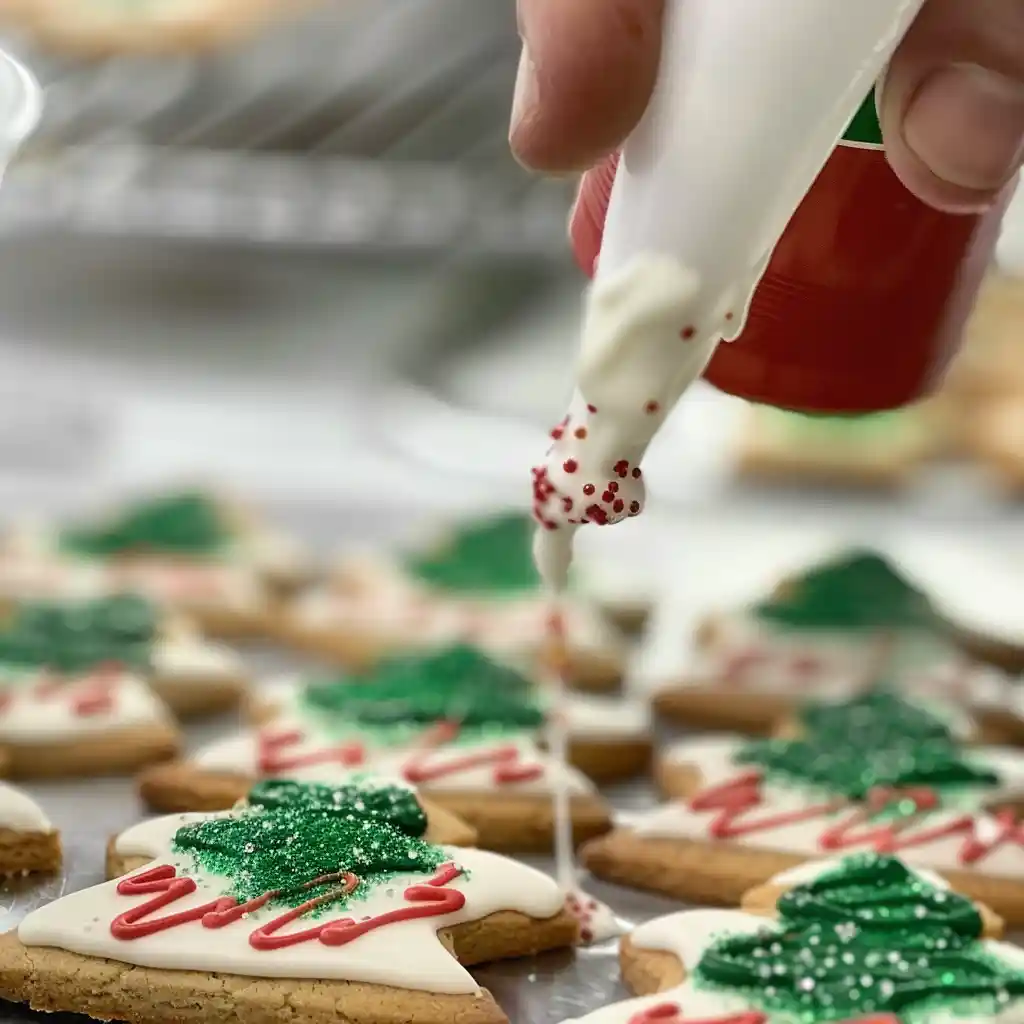 decorating mini little debbie christmas tree cookies icing sprinkles